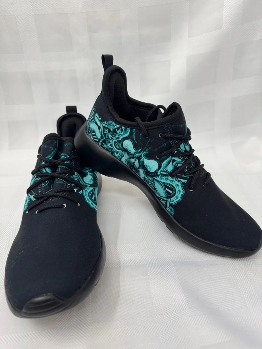 Unisex Black Lightweight Sneakers with Teal Skull Accent